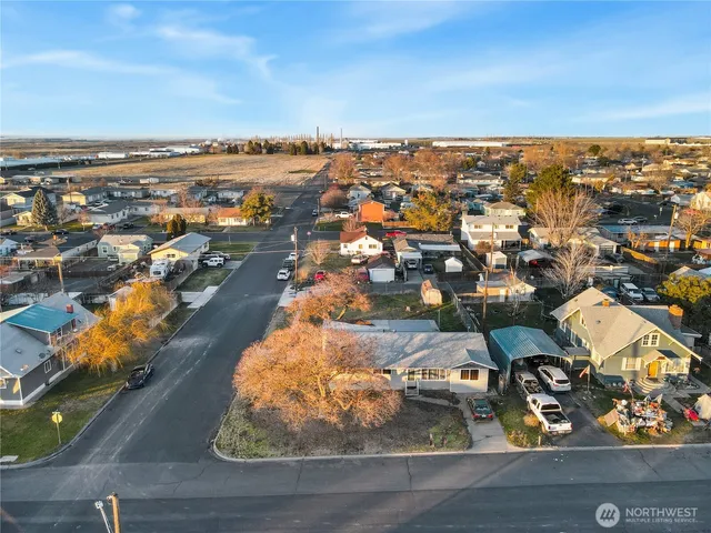an aerial view of residential houses with outdoor space