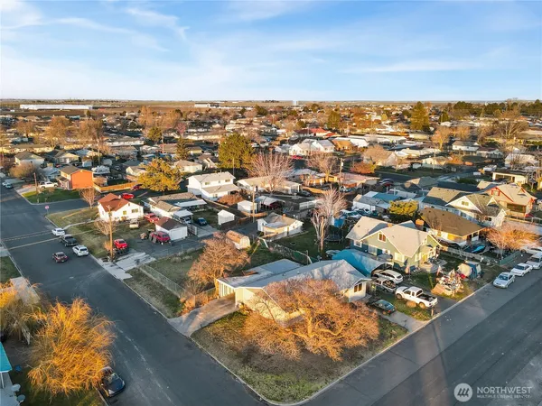an aerial view of residential houses with outdoor space