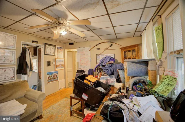a view of a livingroom with furniture and a window