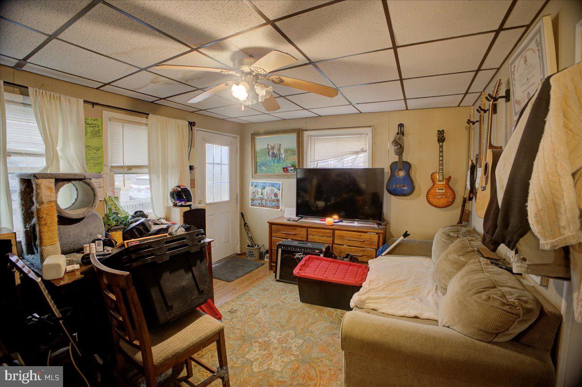 16 Taxi Way Middle River, MD 21220 - Photo 13 of 16 a living room with furniture a flat screen tv and a window