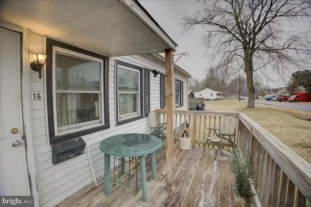 a view of a patio with a table chairs and a table