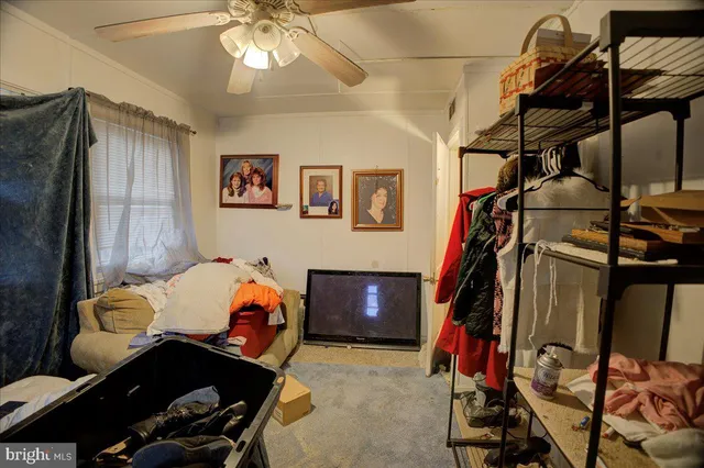 a bedroom with furniture and workout equipment