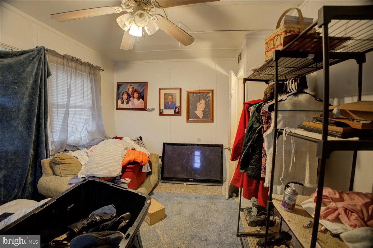 16 Taxi Way Middle River, MD 21220 - Photo 8 of 16 a bedroom with furniture and workout equipment