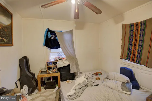 a bedroom with a bed and cabinets