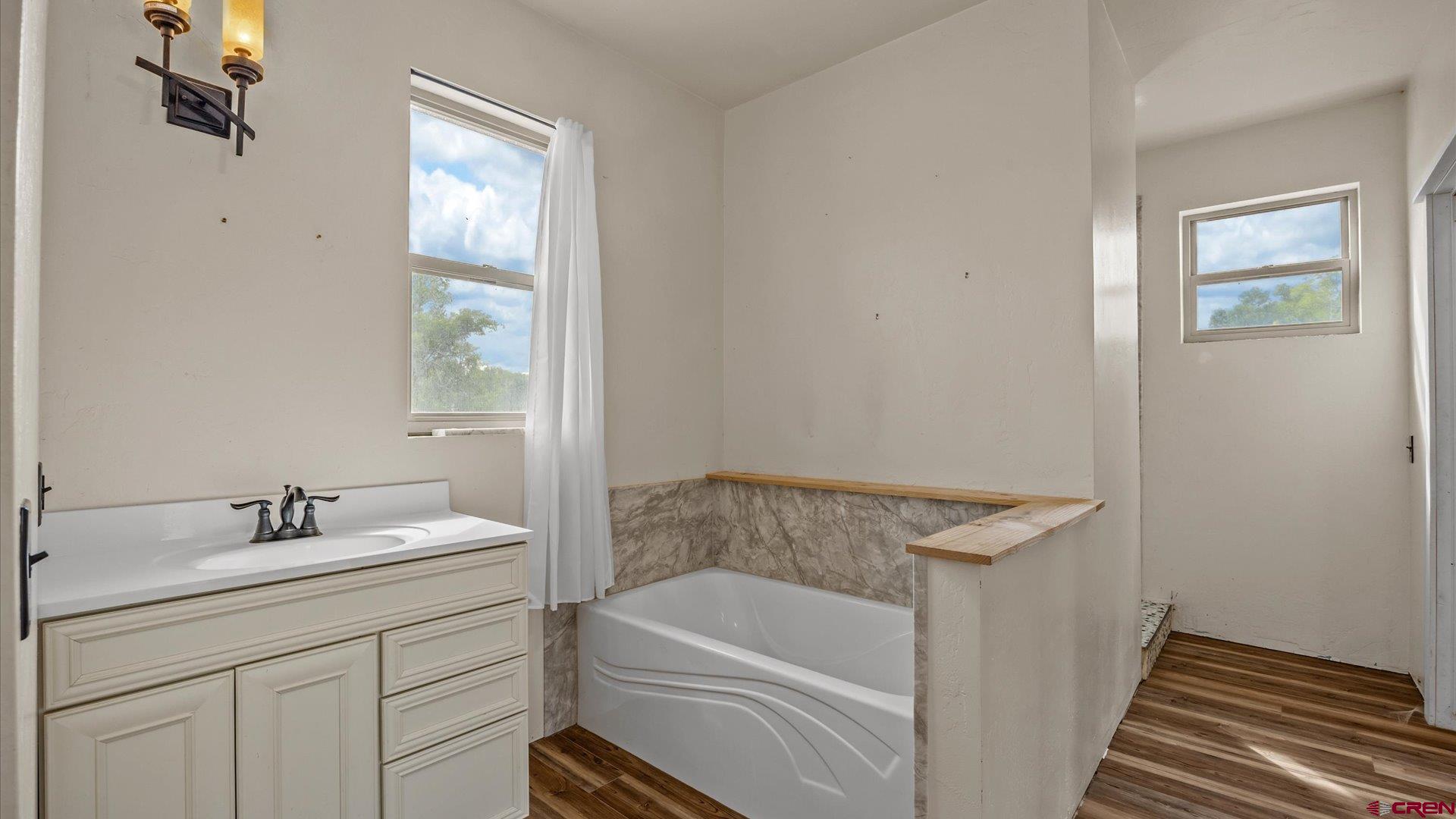 9097 2150th Road Austin, CO 81410 - Photo 9 of 19 a bathroom with a sink and a bathtub