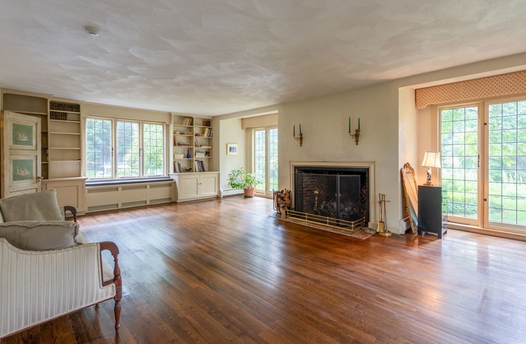 893 Highland Street Hamilton, MA 01982 - Photo 12 of 42 a view of a livingroom with furniture window and wooden floor