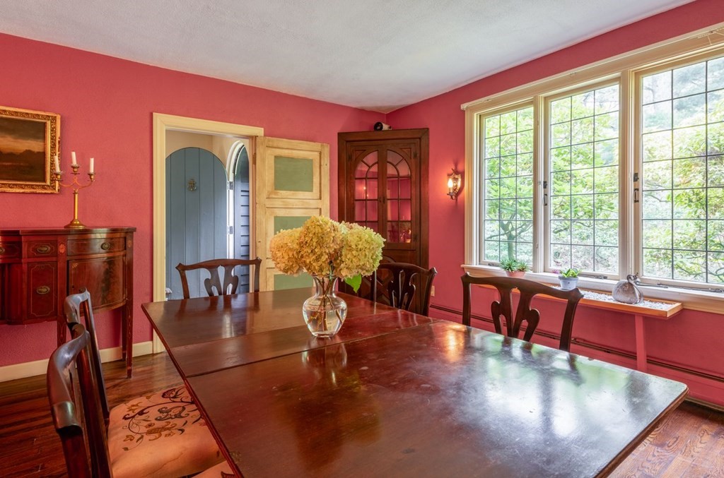 893 Highland Street Hamilton, MA 01982 - Photo 15 of 42 a living room with furniture large window and wooden floor