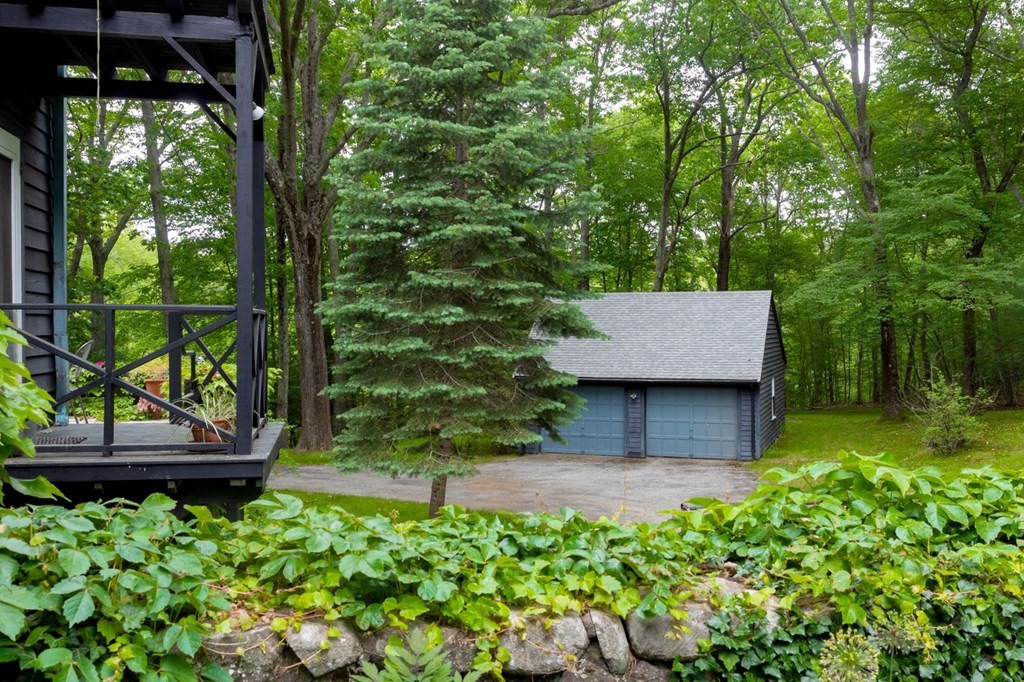893 Highland Street Hamilton, MA 01982 - Photo 24 of 42 a view of house with backyard and a garden