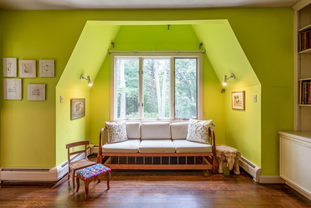 893 Highland Street Hamilton, MA 01982 - Photo 29 of 42 a spacious bedroom with a bed and wooden floor
