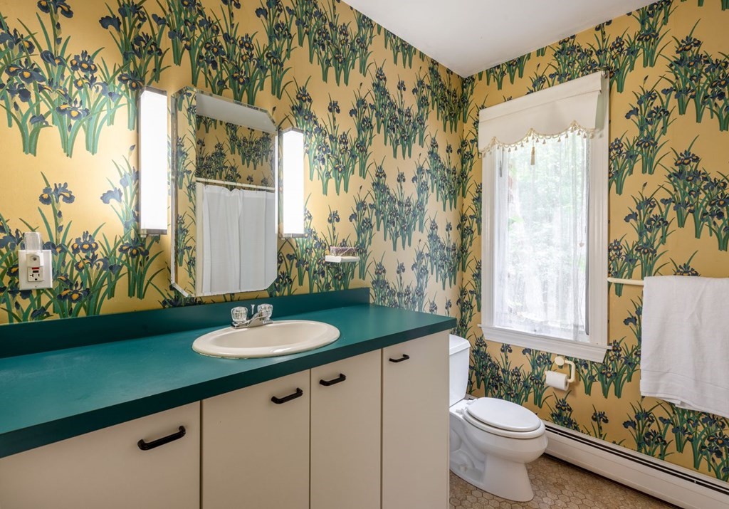 893 Highland Street Hamilton, MA 01982 - Photo 31 of 42 a bathroom with a granite countertop sink and a mirror