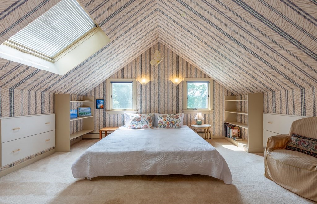 893 Highland Street Hamilton, MA 01982 - Photo 35 of 42 a spacious bedroom with a bed and a large window