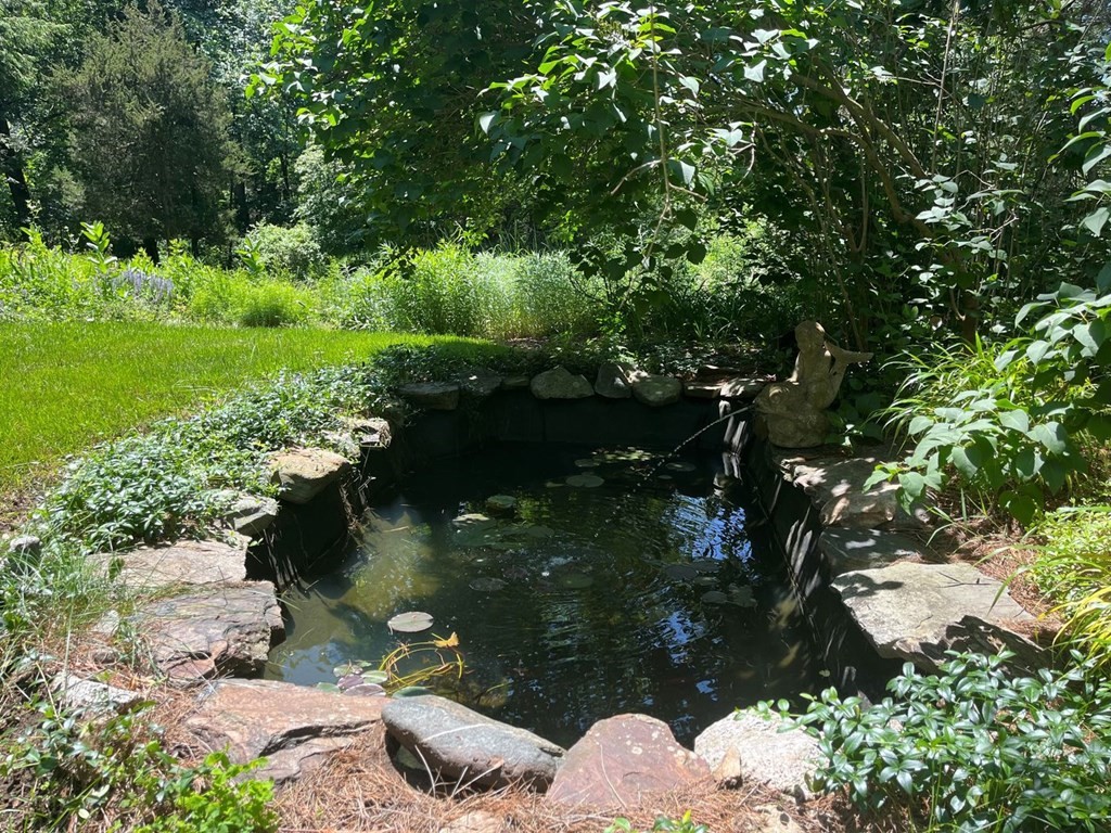 893 Highland Street Hamilton, MA 01982 - Photo 38 of 42 a view of a lake with a tree