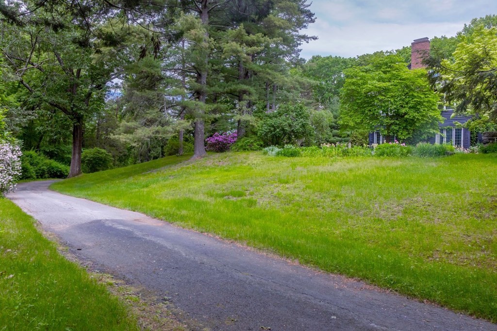 893 Highland Street Hamilton, MA 01982 - Photo 6 of 42 a backyard of a house with lots of green space