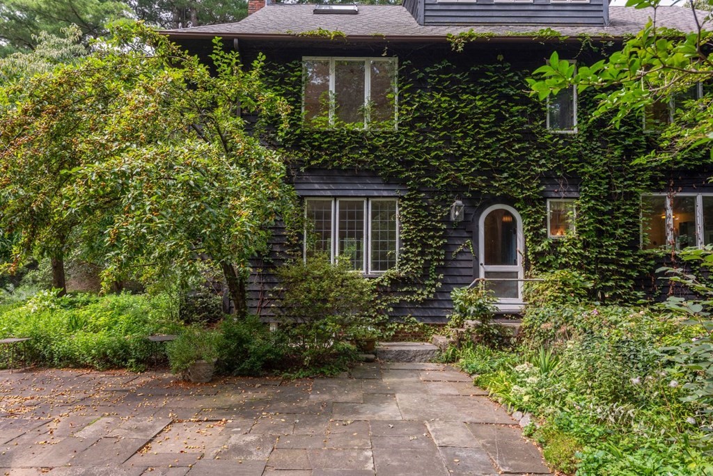 893 Highland Street Hamilton, MA 01982 - Photo 9 of 42 a front view of a house with a yard
