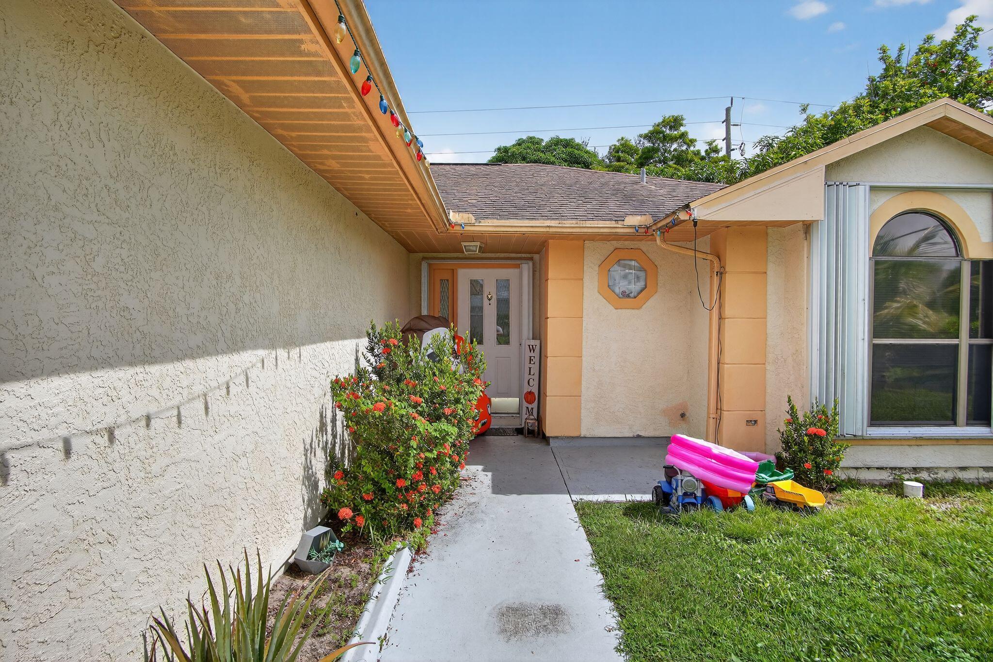 3053 Southeast Wake Road Port St. Lucie, FL 34984 - Photo 12 of 28 a view of a back yard of the house