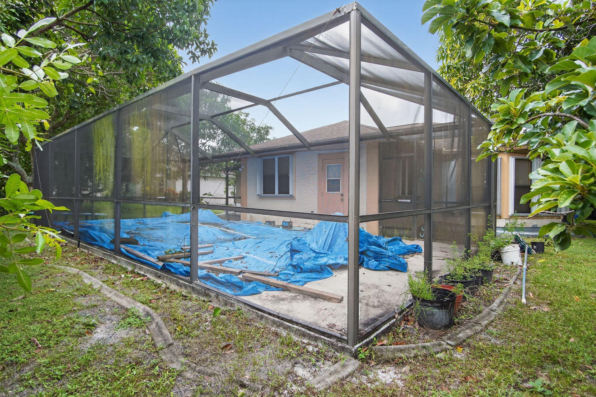 3053 Southeast Wake Road Port St. Lucie, FL 34984 - Photo 16 of 28 a view of a backyard