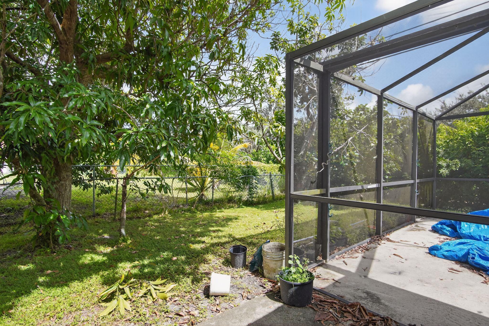3053 Southeast Wake Road Port St. Lucie, FL 34984 - Photo 18 of 28 a view of a patio with chair and table