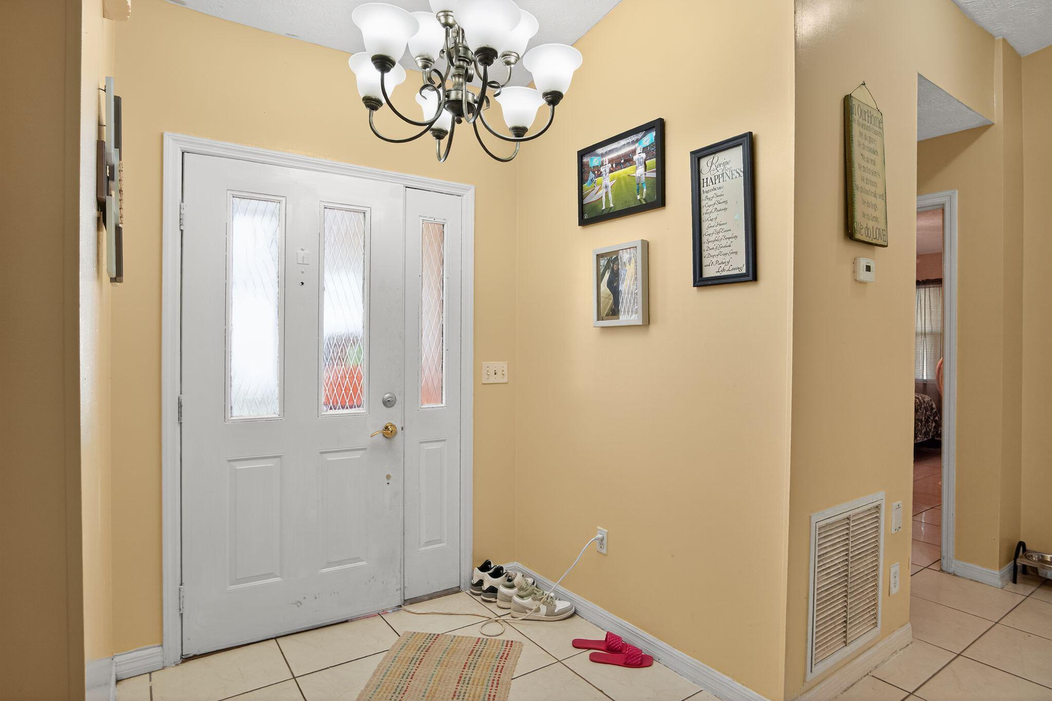 3053 Southeast Wake Road Port St. Lucie, FL 34984 - Photo 19 of 28 a view of a bedroom and bathroom