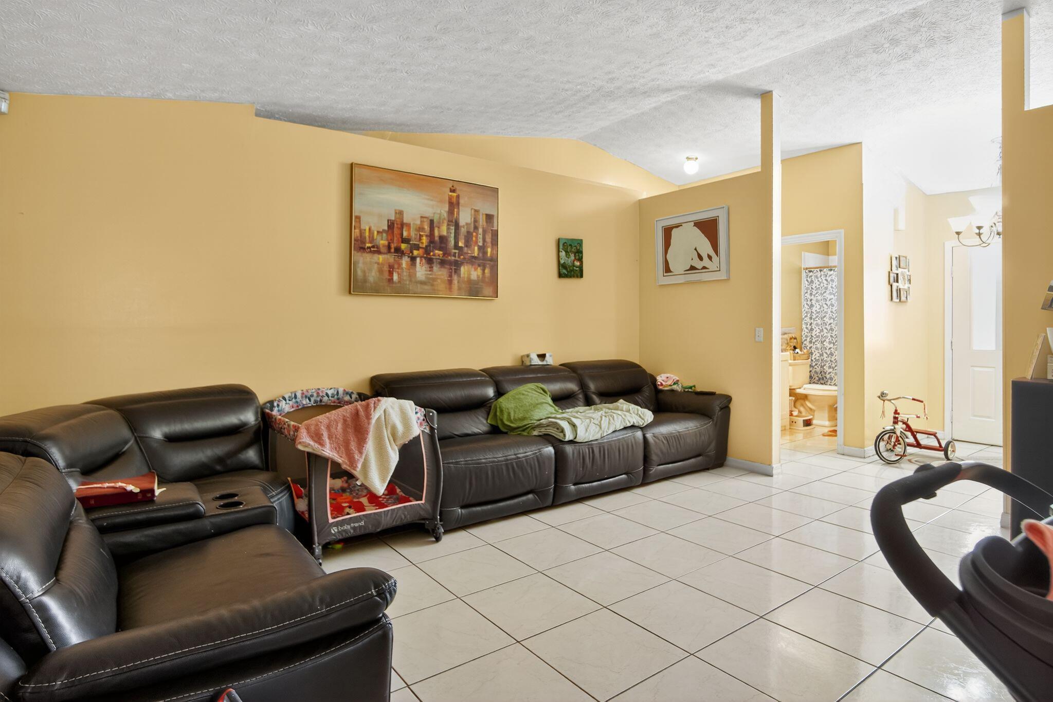 3053 Southeast Wake Road Port St. Lucie, FL 34984 - Photo 20 of 28 a living room with furniture and a couch