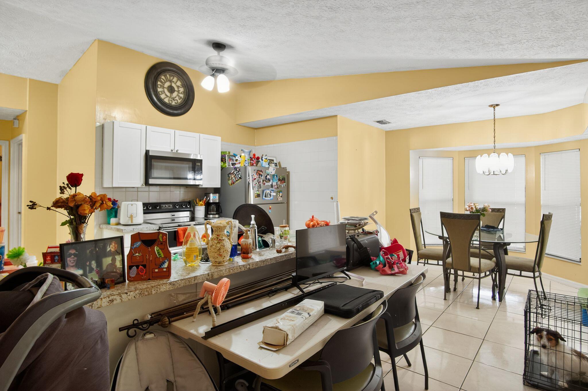 3053 Southeast Wake Road Port St. Lucie, FL 34984 - Photo 23 of 28 a living room with furniture and a flat screen tv