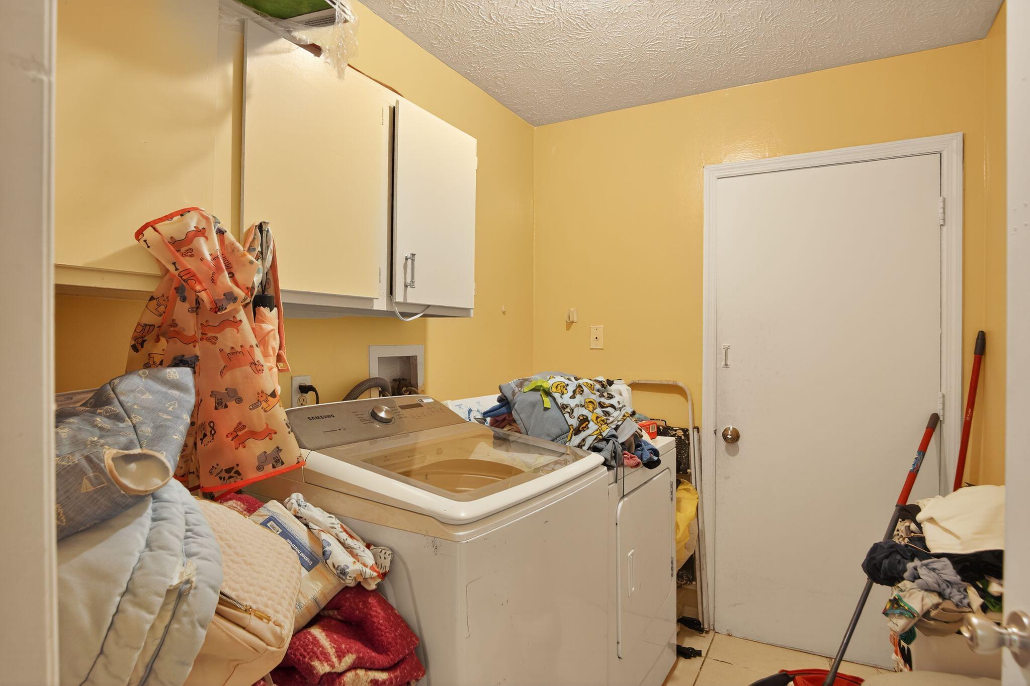 3053 Southeast Wake Road Port St. Lucie, FL 34984 - Photo 10 of 28 a utility room with dryer and washer