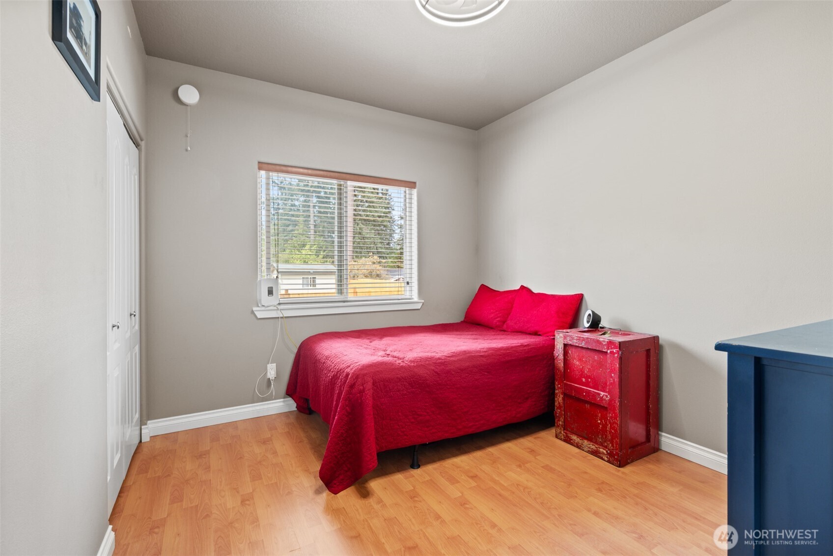 102 Sierra Drive Sequim, WA 98382 - Photo 24 of 40 a bedroom with a bed and window