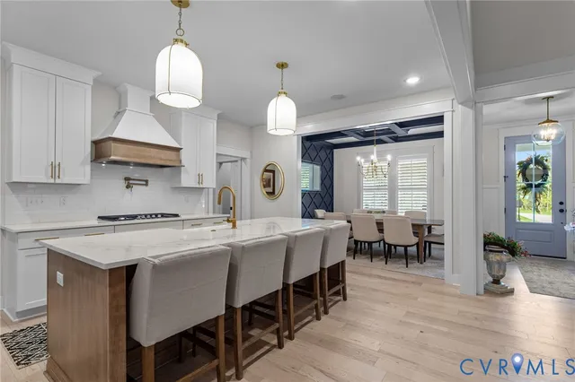 a kitchen that has a table and chairs in it