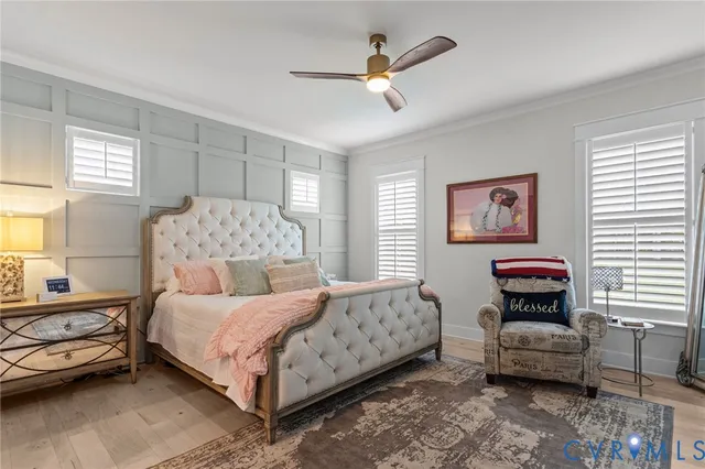 a bedroom with a bed a couch and a window