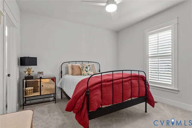 a bedroom with bed and a window