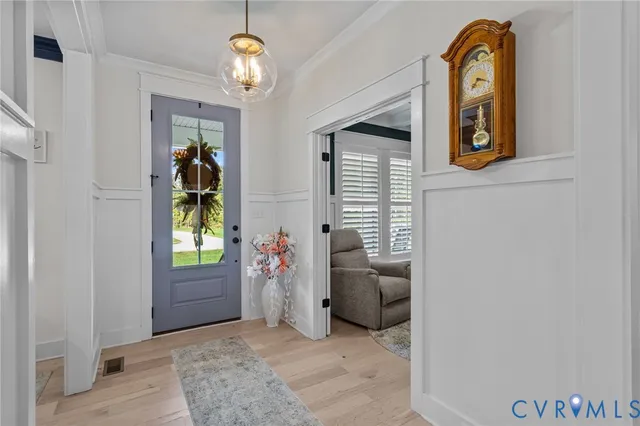 a view of entryway with livingroom and painted walls