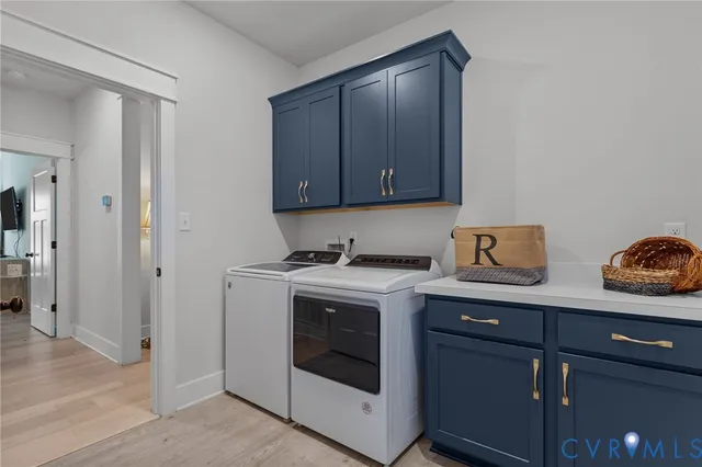 a view of a kitchen with sink and wooden floor