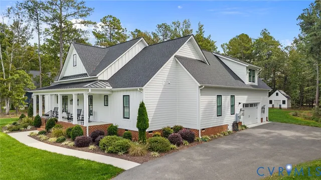 an aerial view of a house with swimming pool and outdoor space
