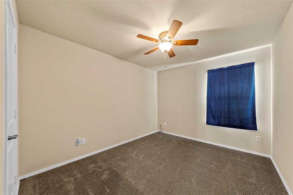 716 Harrison Lane Lavon, TX 75166 - Photo 20 of 40 an empty room with windows and fan