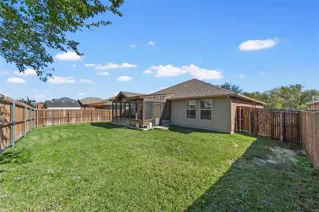 an aerial view of a house with swimming pool and ocean view