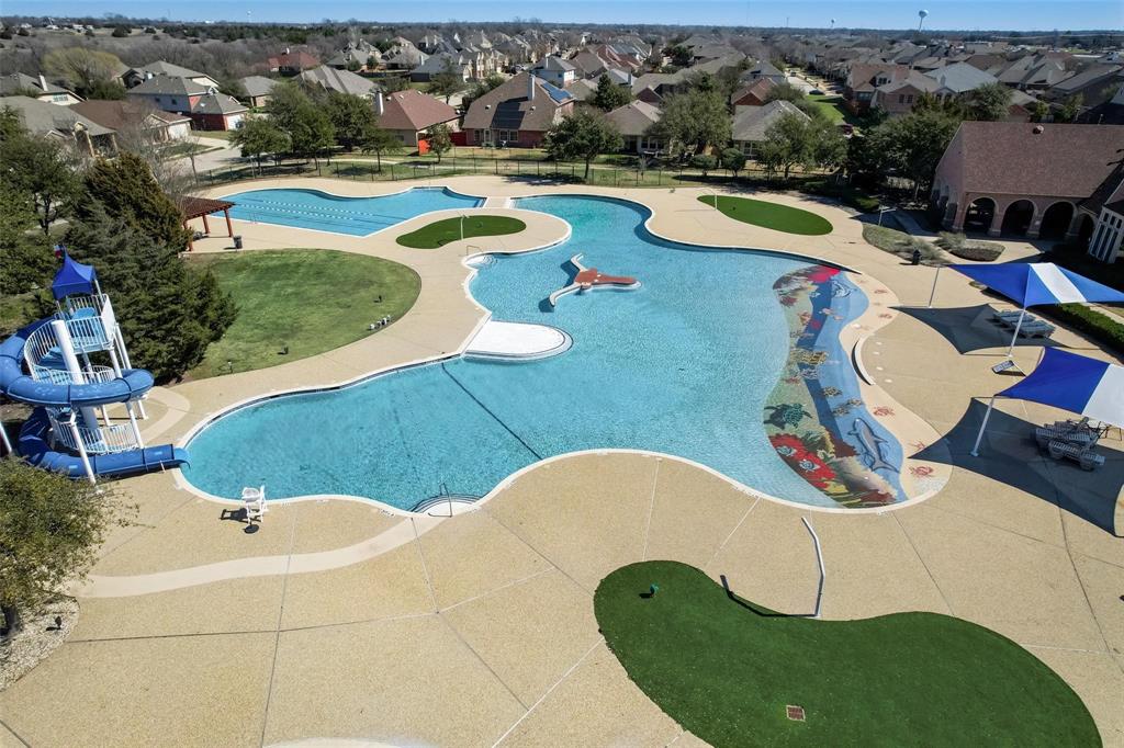 716 Harrison Lane Lavon, TX 75166 - Photo 36 of 40 an aerial view of a house with swimming pool and ocean view