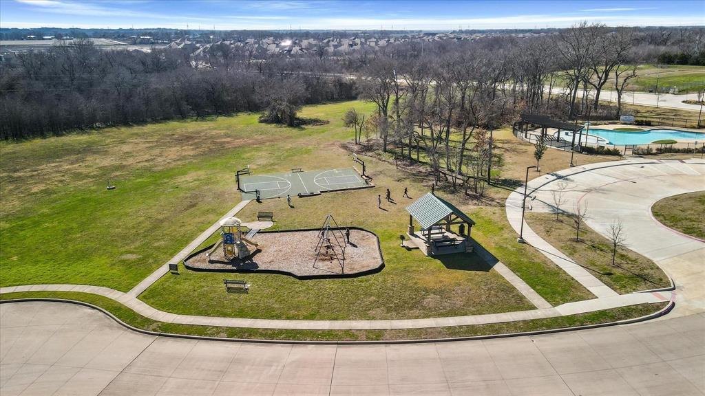 716 Harrison Lane Lavon, TX 75166 - Photo 40 of 40 a view of a swimming pool with a yard
