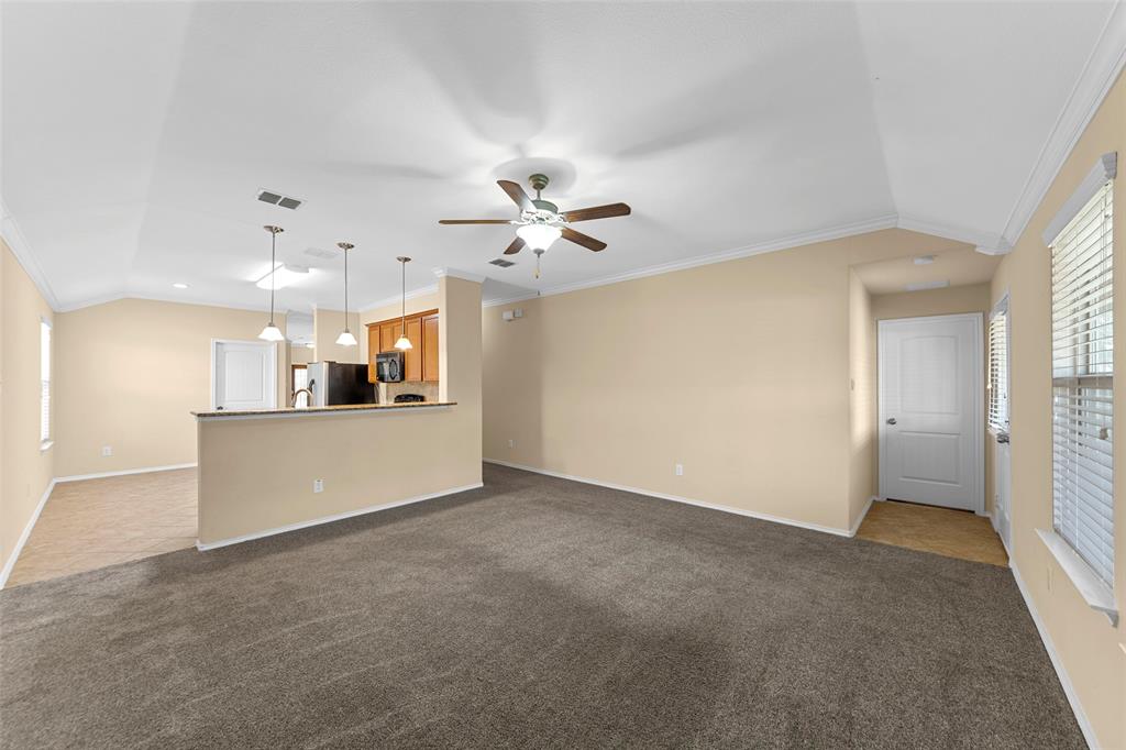 716 Harrison Lane Lavon, TX 75166 - Photo 7 of 40 a view of a kitchen with a sink and a ceiling fan