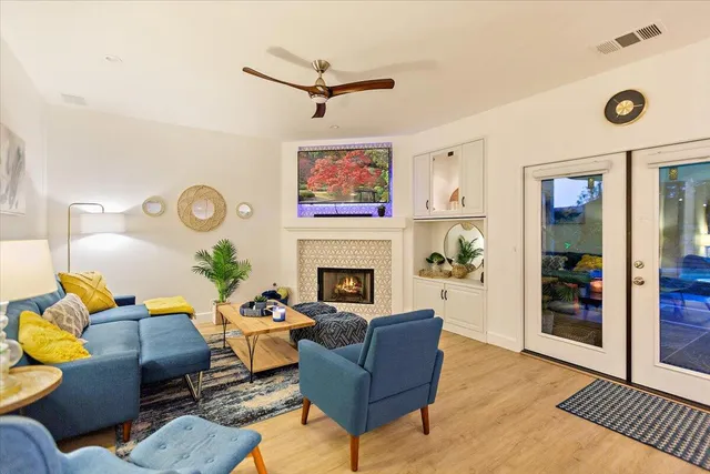 a kitchen view with white cabinets and stainless steel appliances