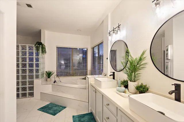 a bedroom with a bed and a potted plant