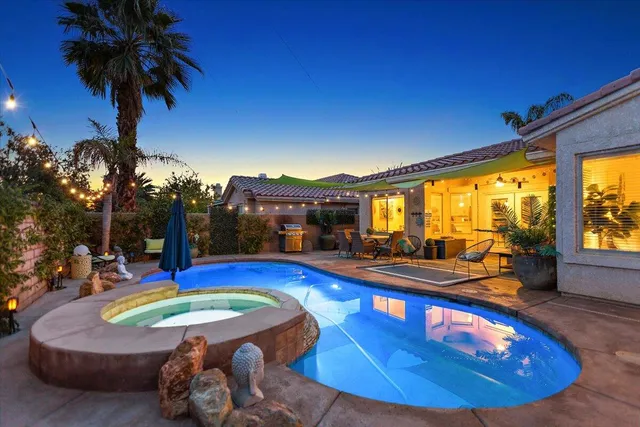 a view of swimming pool with outdoor seating