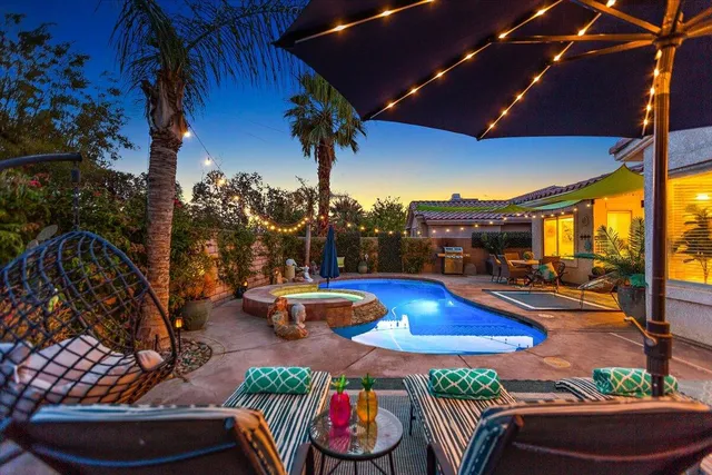 a view of swimming pool with chairs