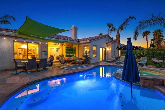 an outdoor space with furniture and umbrella