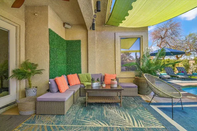 a view of an outdoor sitting area with furniture