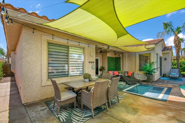 a view of swimming pool with outdoor seating