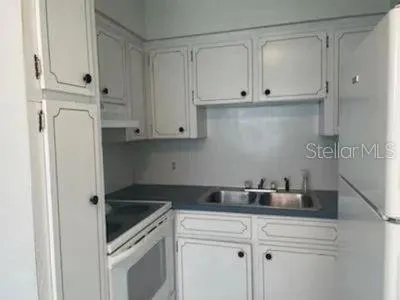 a view of cabinets and wooden floor