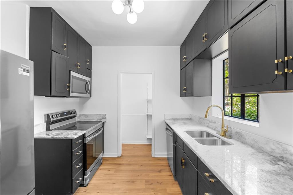 1981 North Decatur Road Atlanta, GA 30307 - Photo 6 of 20 a kitchen with a sink stove and cabinets