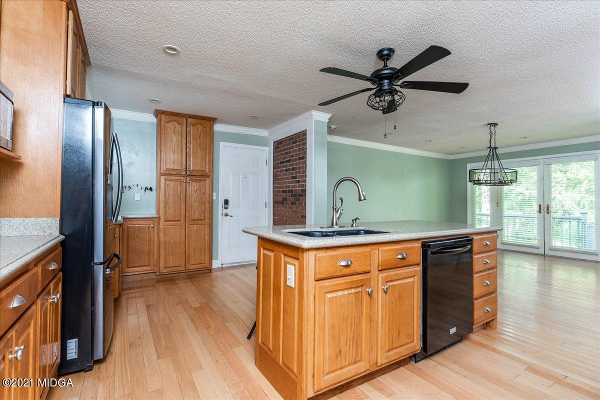 455 Lite-N-Tie Road Gray, GA 31032 - Photo 13 of 47 a kitchen with stainless steel appliances granite countertop a stove and a refrigerator