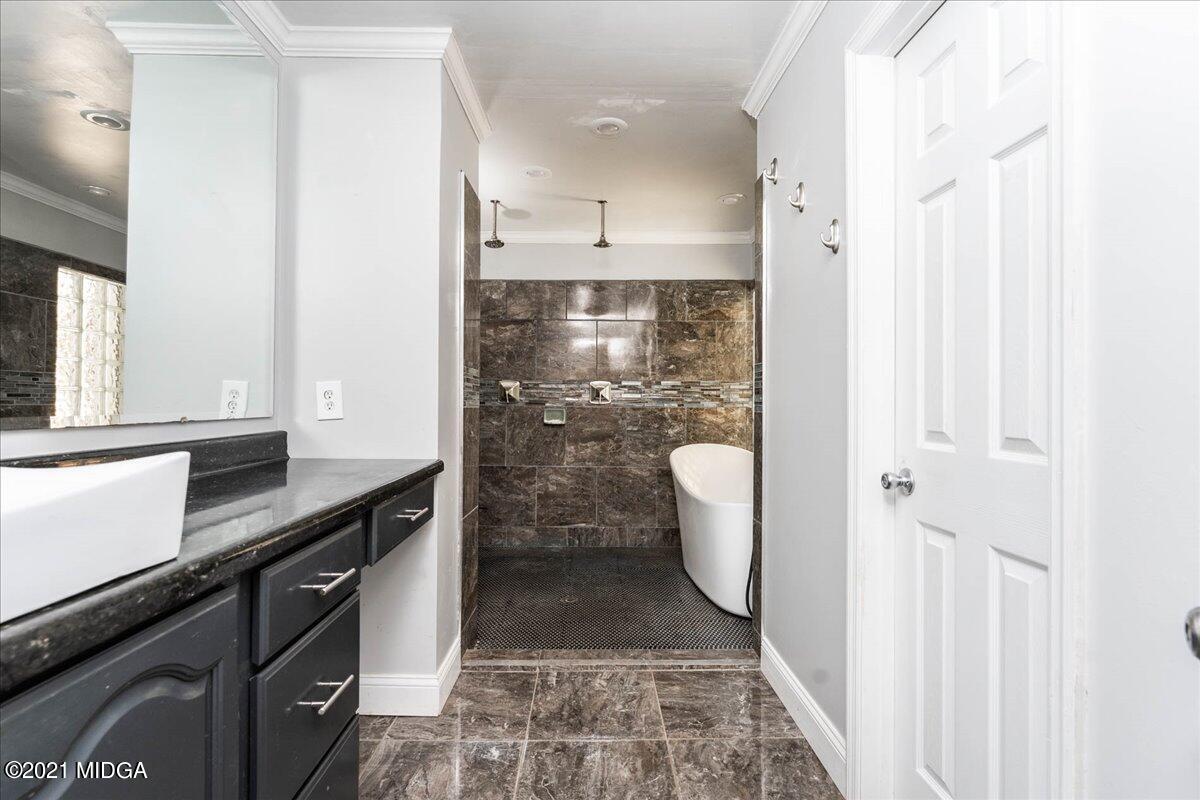 455 Lite-N-Tie Road Gray, GA 31032 - Photo 20 of 47 a view of a bathroom with a sink and a mirror
