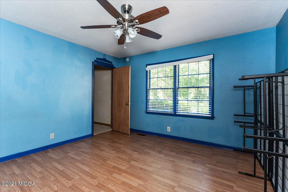 455 Lite-N-Tie Road Gray, GA 31032 - Photo 22 of 47 a view of an empty room with a window