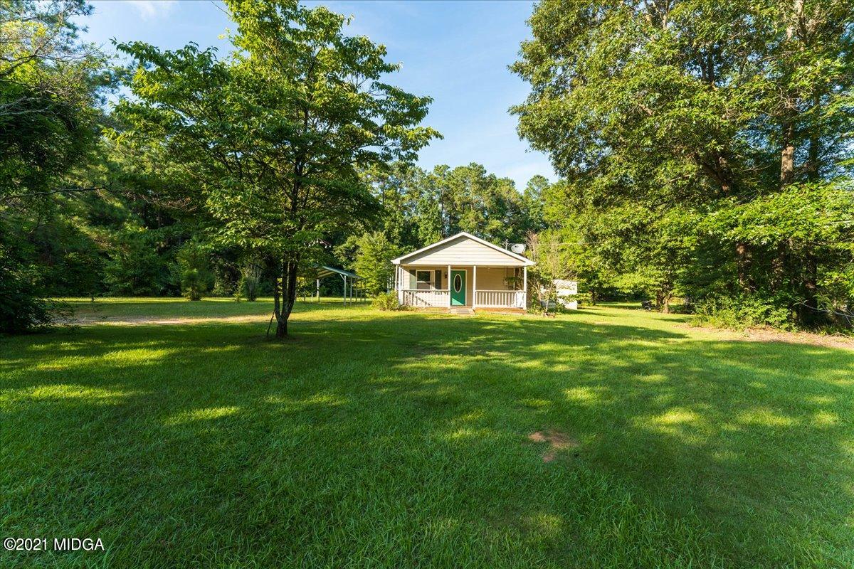 455 Lite-N-Tie Road Gray, GA 31032 - Photo 27 of 47 a front view of a house with a yard